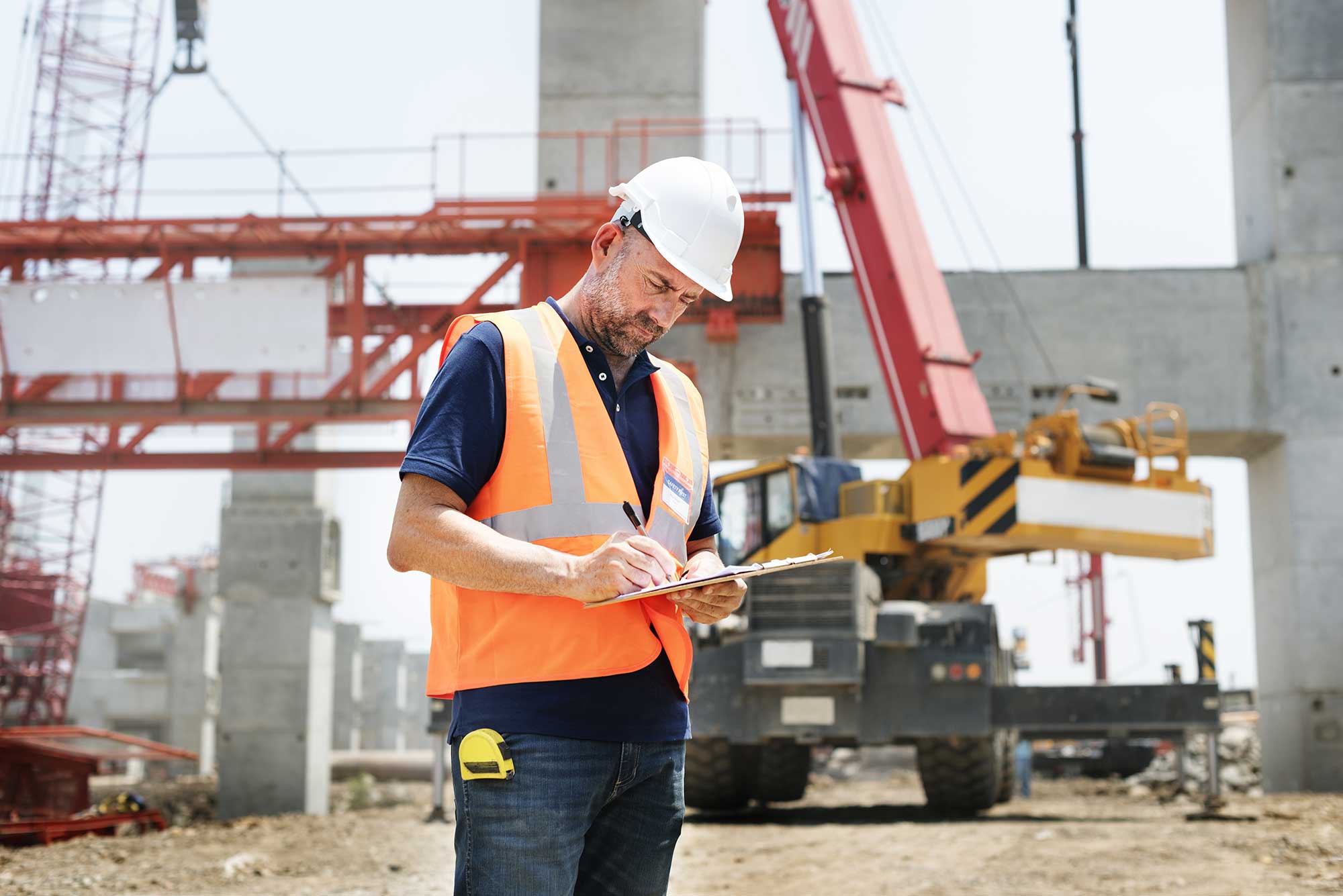 Construction worker reviewing project plans – CityGCon, trusted General Contractor Brooklyn NY.