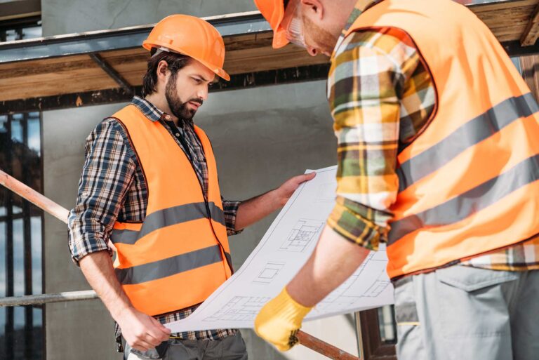 Workers viewing the construction map