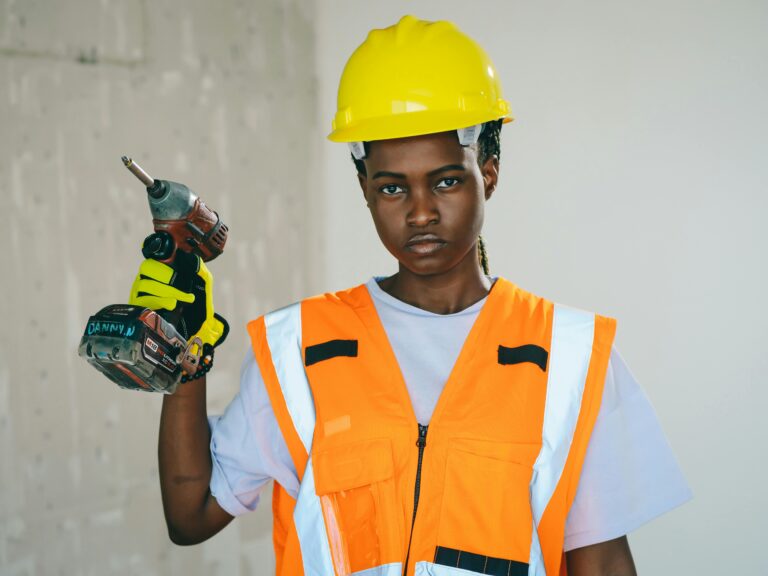 Female worker holding Power drill