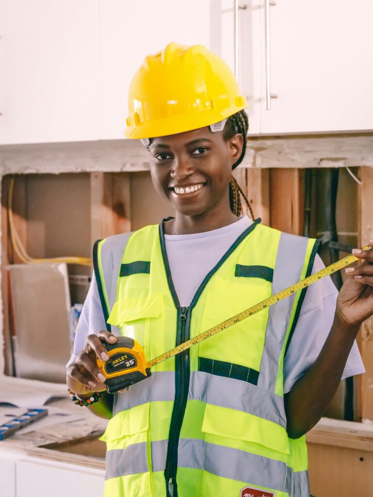 Girl worker holding measuring tape